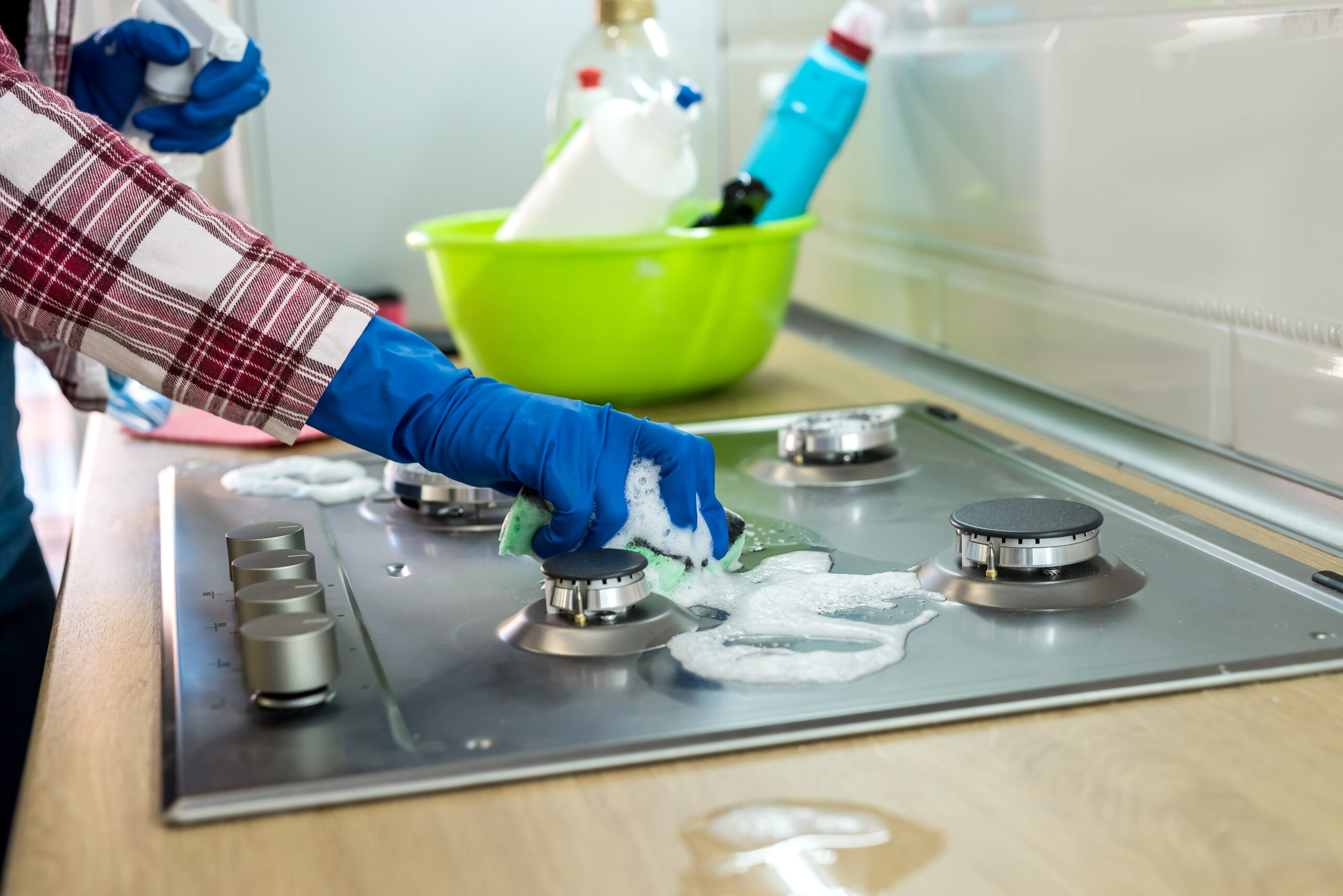 Woman,With,Sponge,And,Rubber,Protective,Glove,Used,To,Wipe